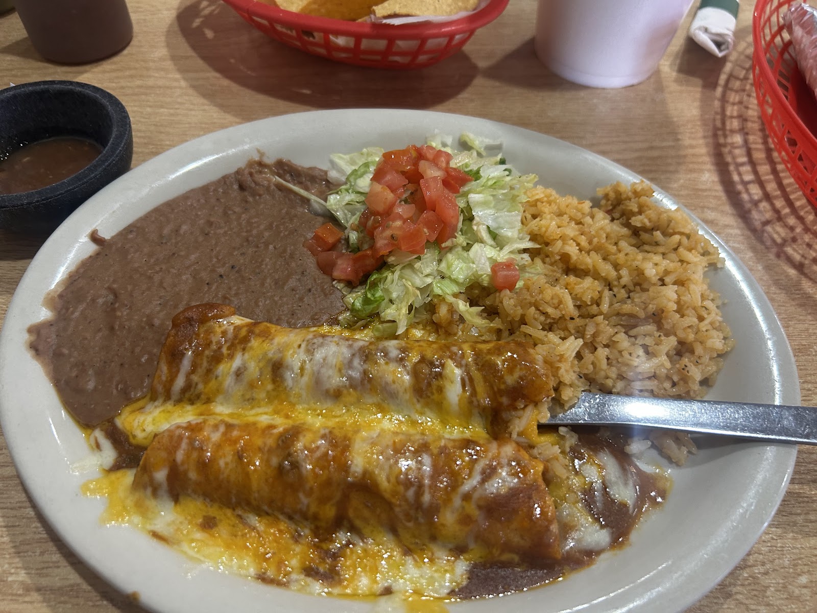 Cheese enchilada plate with rice, refried beans, and fresh pico de gallo